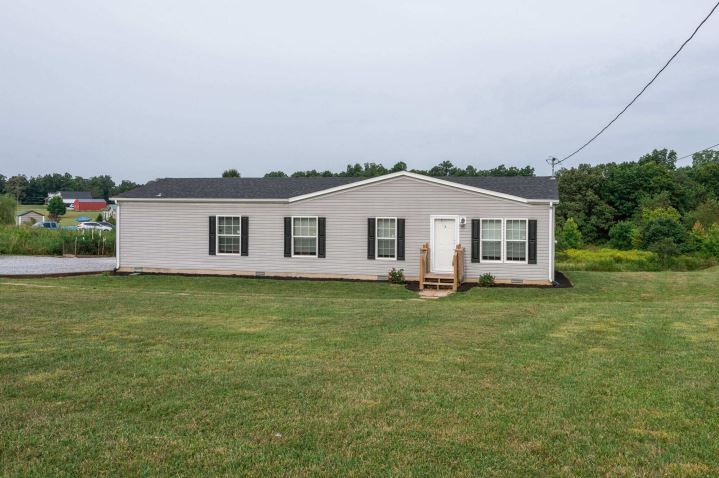 2800 Lock Hollow Road Dickson, TN 37055 - Photo 4 of 26 a view of a yard in front of a house with a large tree