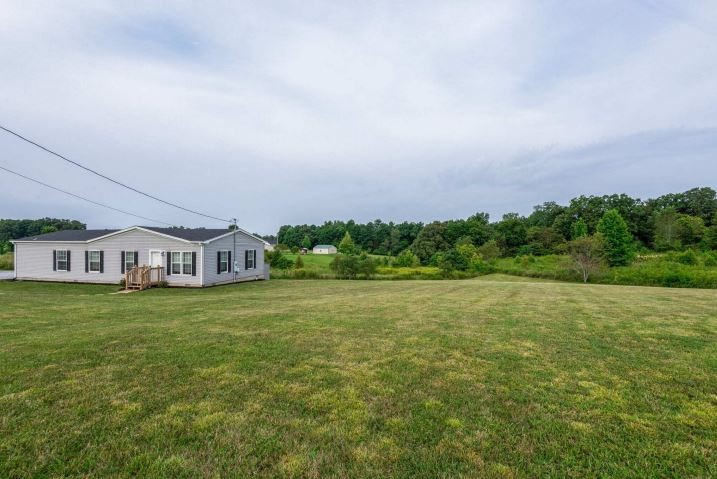 2800 Lock Hollow Road Dickson, TN 37055 - Photo 5 of 26 a house with huge green field in front of it
