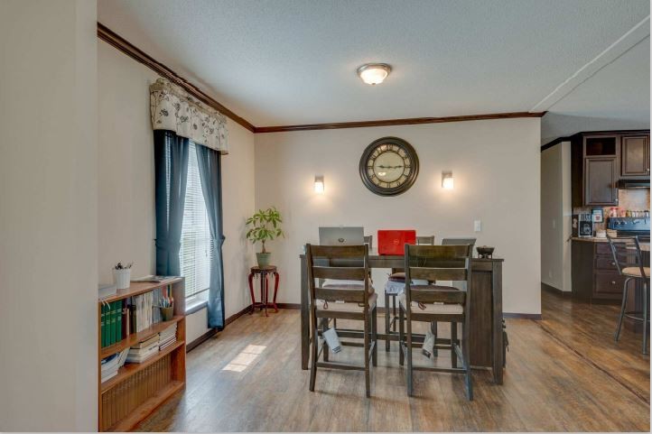 2800 Lock Hollow Road Dickson, TN 37055 - Photo 8 of 26 a view of a dining room and kitchen with furniture and wooden floor