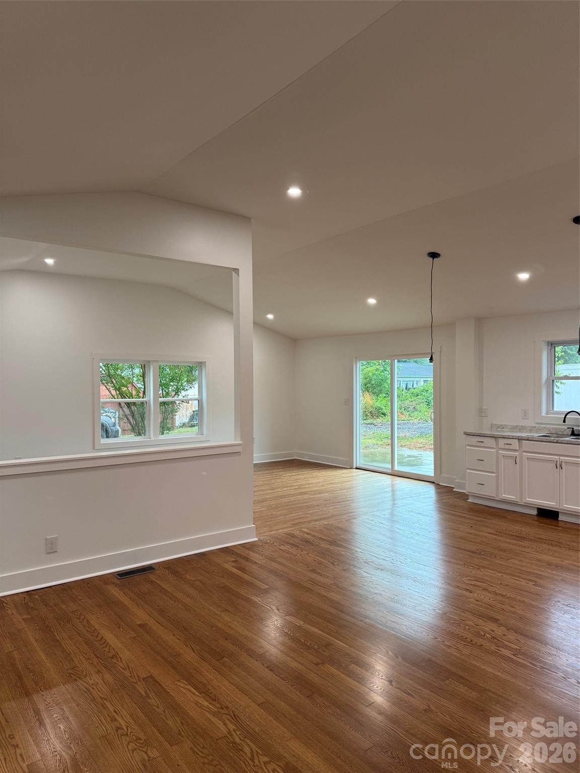 2677 Pax Hill Road Morganton, NC 28655 - Photo 12 of 15 a view of an empty room with wooden floor and a window