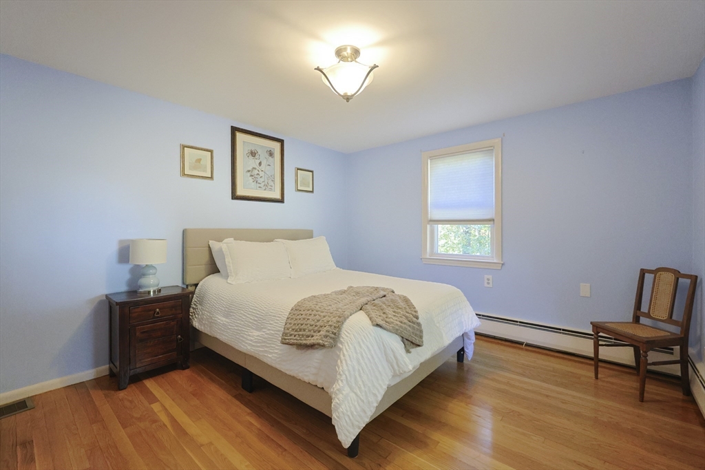 28 Forest Road Millis, MA 02054 - Photo 12 of 23 a bedroom with a bed and a window