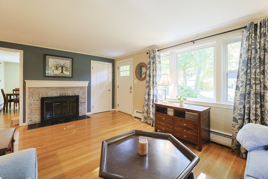 28 Forest Road Millis, MA 02054 - Photo 3 of 23 a view of a livingroom with furniture and a fireplace