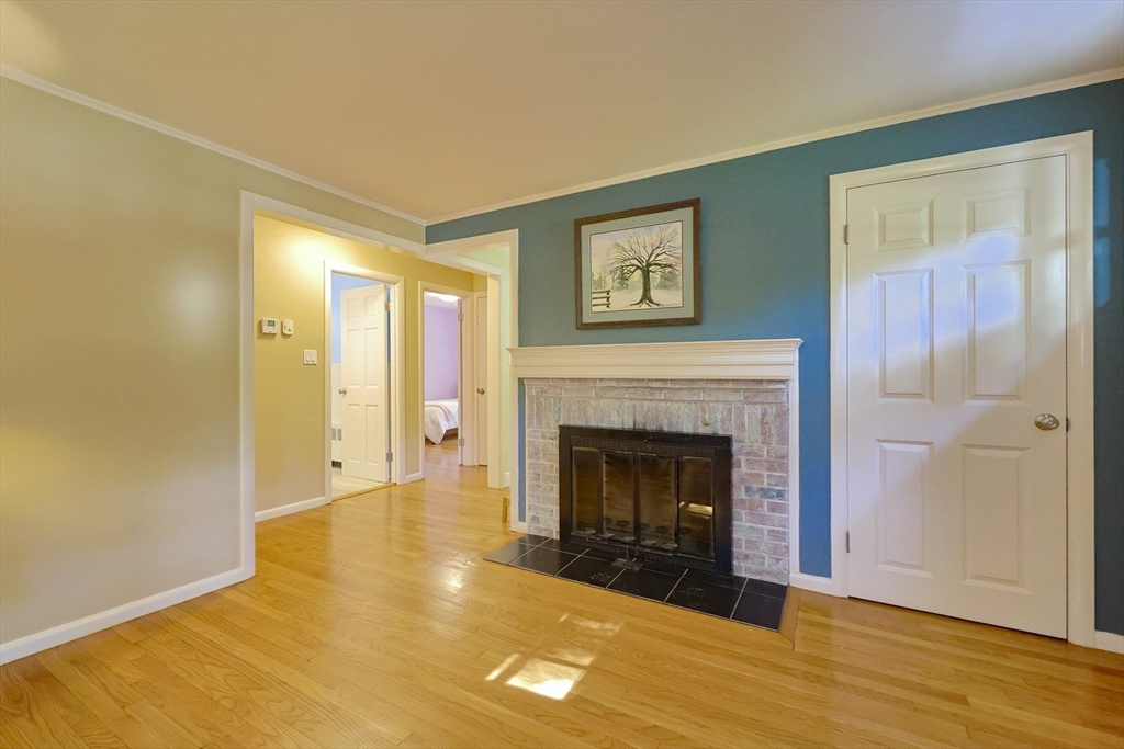 28 Forest Road Millis, MA 02054 - Photo 4 of 23 a living room with a fireplace