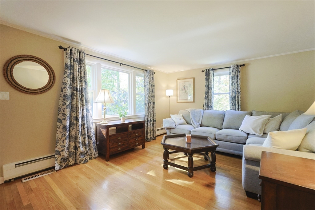 28 Forest Road Millis, MA 02054 - Photo 5 of 23 a living room with furniture a window and wooden floor