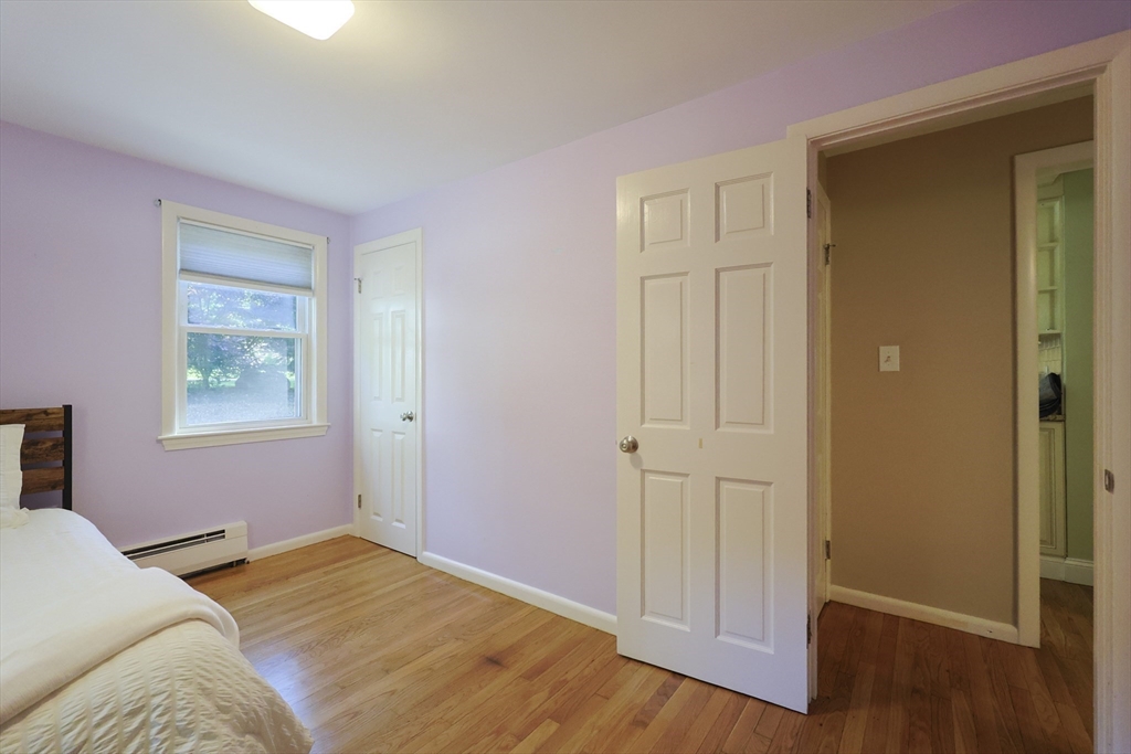 28 Forest Road Millis, MA 02054 - Photo 10 of 23 a bedroom with a bed and wooden floor