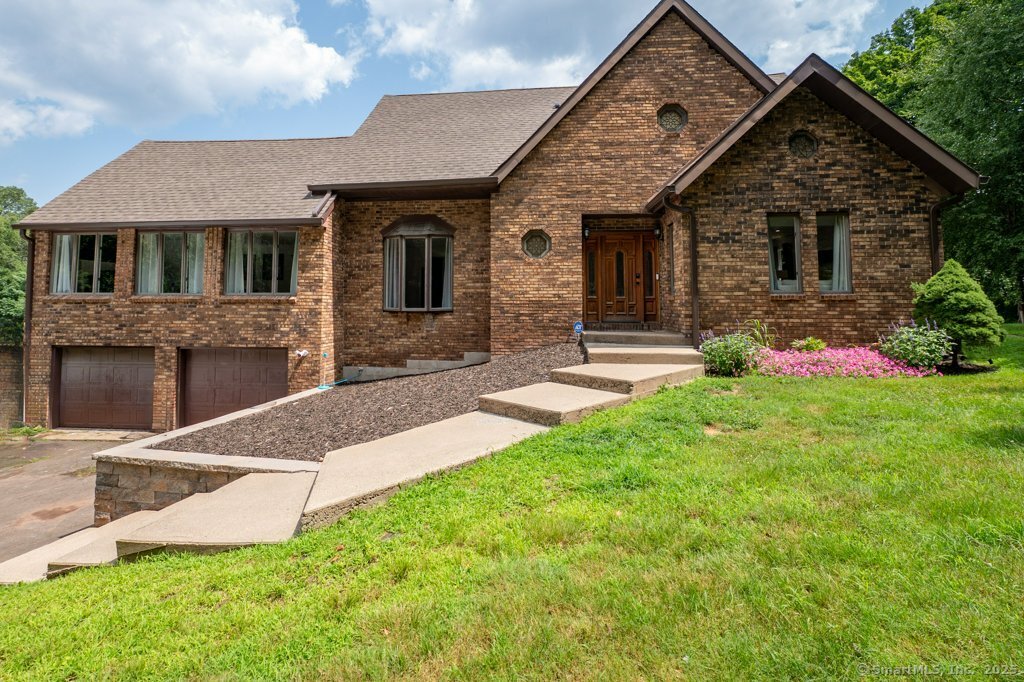 a front view of house with yard and green space