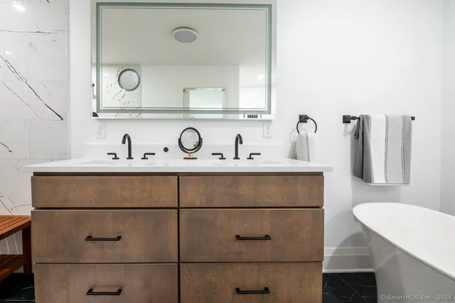 a bathroom with a sink and a mirror