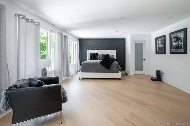 a living room with furniture and a lamp