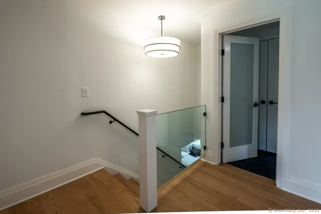 a view of a room with wooden floor