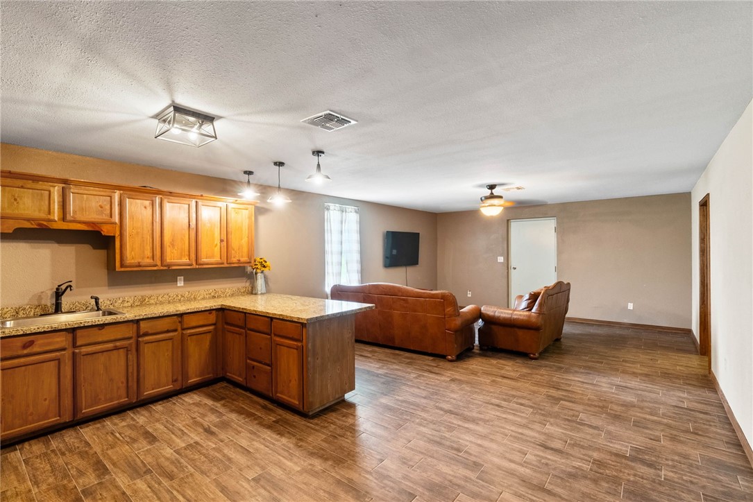 9574 County Road 245 Concepcion, TX 78349 - Photo 5 of 29 a kitchen with stainless steel appliances granite countertop a sink and cabinets