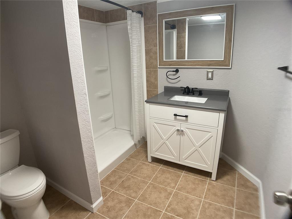 5038 Northeast Sandy Road Arcadia, FL 34266 - Photo 21 of 42 a bathroom with a sink toilet and shower