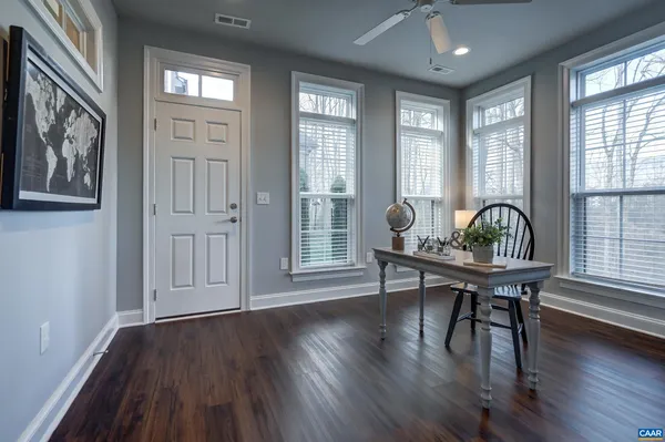 a livingroom with fireplace dining room and wooden floor