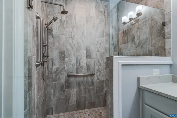 a kitchen with a refrigerator and a stove top oven