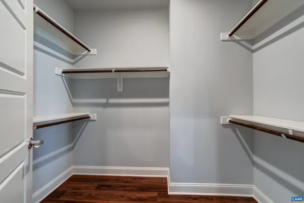 a bathroom with a sink toilet and a mirror