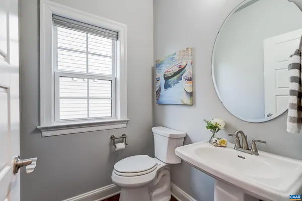 en empty room with a ceiling fan and a window