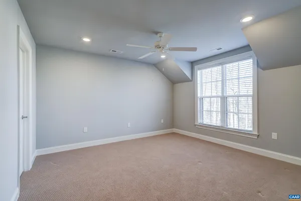 a view of a house with a yard and garage