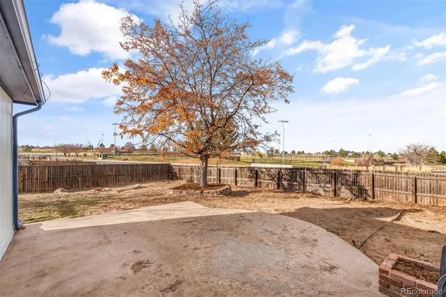 a view of a lake with a house in the background