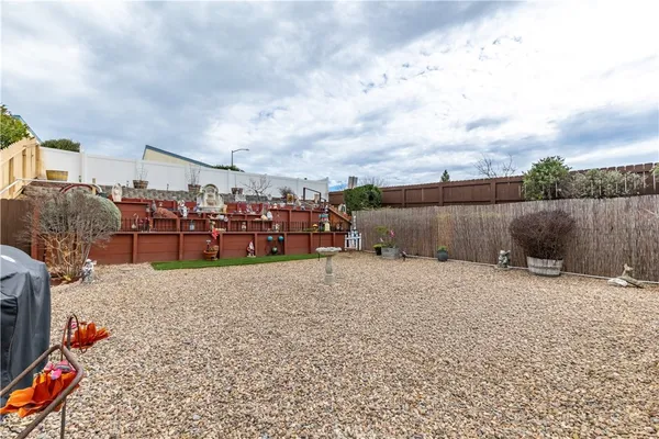 a backyard of a house with barbeque oven