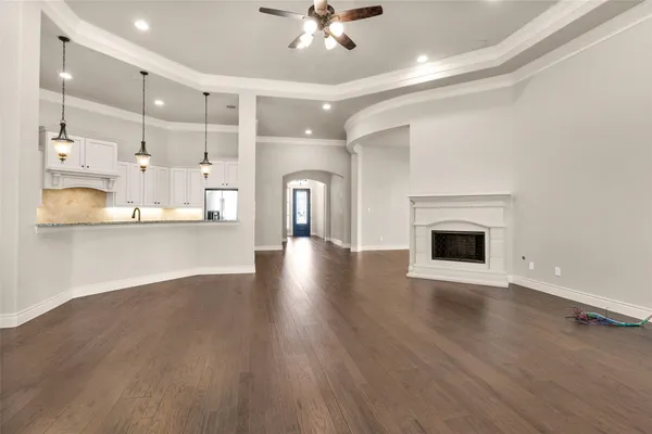 a view of a kitchen with a sink and a fireplace