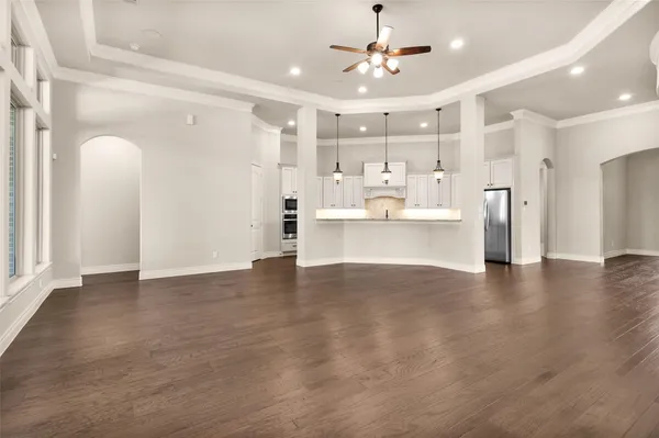 a view of a kitchen with a sink and a refrigerator