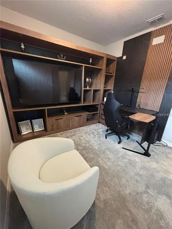 4812 Lime Rickey Alley Winter Garden, FL 34787 - Photo 14 of 19 a living room with furniture and a flat screen tv