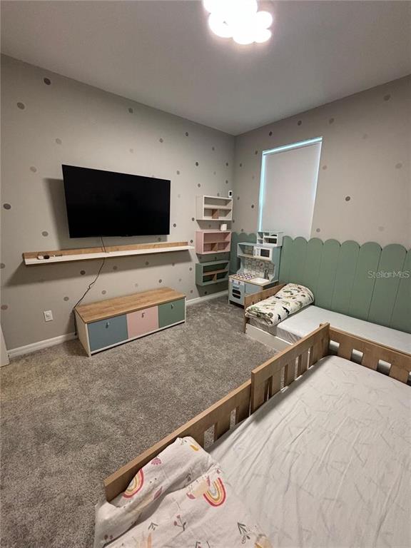 4812 Lime Rickey Alley Winter Garden, FL 34787 - Photo 15 of 19 a living room with furniture and a flat screen tv