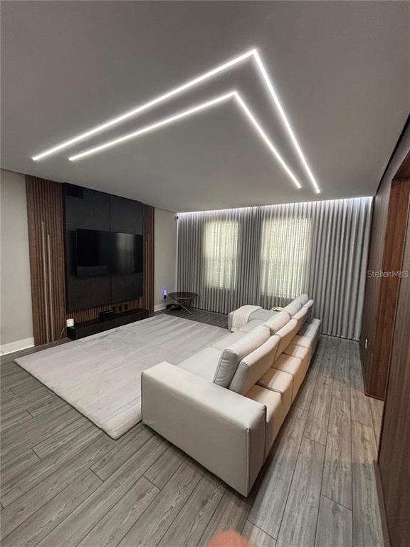 4812 Lime Rickey Alley Winter Garden, FL 34787 - Photo 2 of 19 a living room with furniture and a flat screen tv