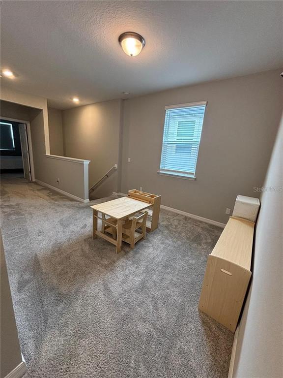 4812 Lime Rickey Alley Winter Garden, FL 34787 - Photo 8 of 19 a living room with furniture and a window