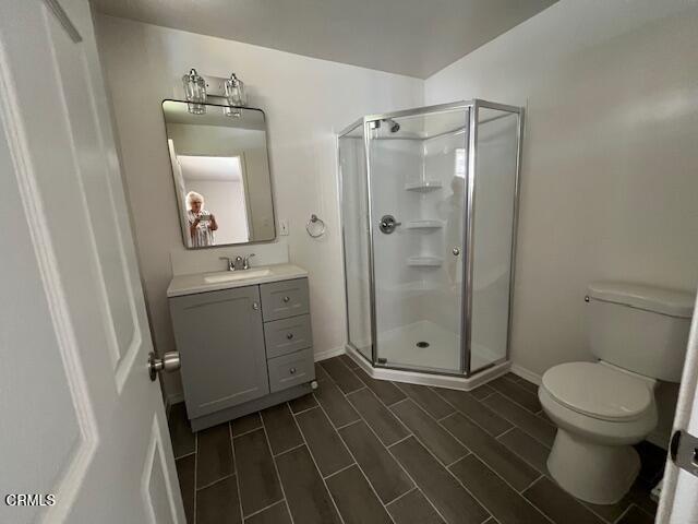 10031 Marcus Avenue Tujunga, CA 91042 - Photo 15 of 27 a bathroom with a toilet a sink and shower