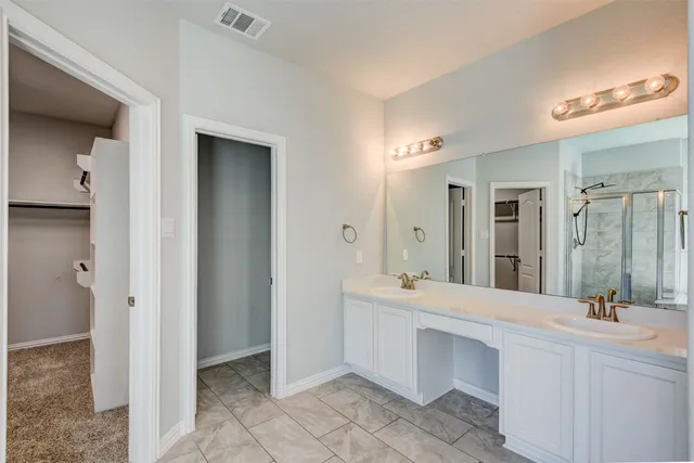 a bathroom with a tub and shower