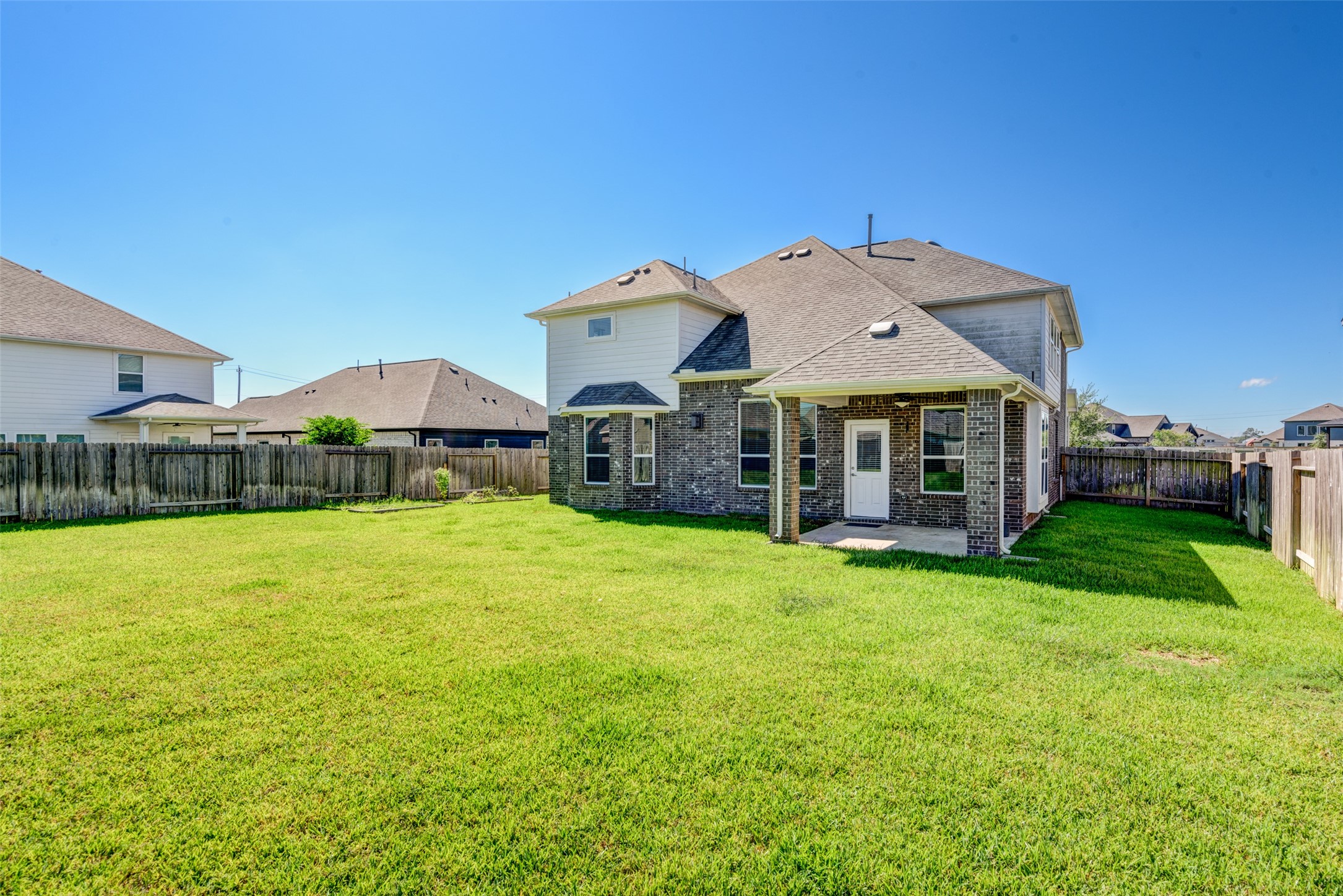 23421 Vineyard Drive Alvin, TX 77511 - Photo 30 of 32 a front view of a house with garden