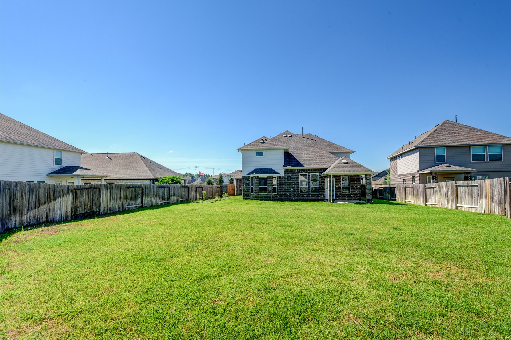 23421 Vineyard Drive Alvin, TX 77511 - Photo 31 of 32 a front view of a house with yard and green space