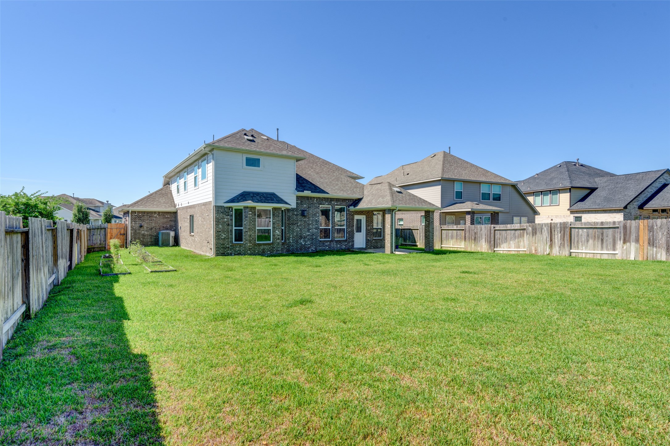 23421 Vineyard Drive Alvin, TX 77511 - Photo 32 of 32 a front view of a house with a yard