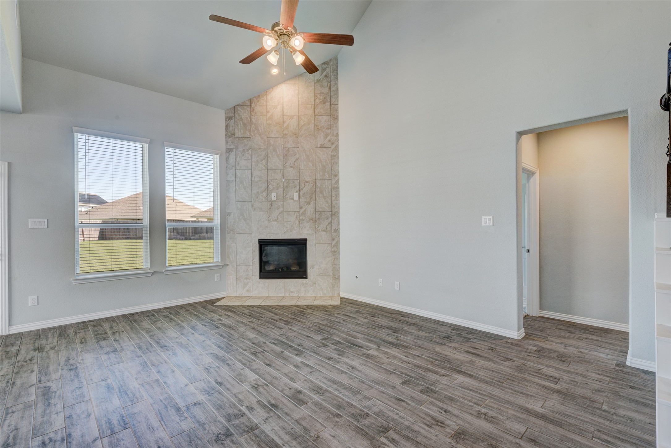 23421 Vineyard Drive Alvin, TX 77511 - Photo 6 of 32 a view of empty room with wooden floor and fan