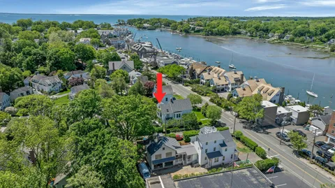 an aerial view of a house with a lake view