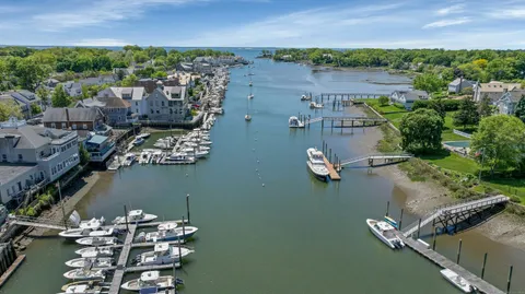 an aerial view of a house with a lake view