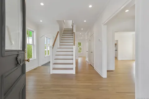 a view of entryway with wooden floor