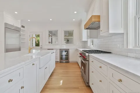 a kitchen with cabinets and stainless steel appliances