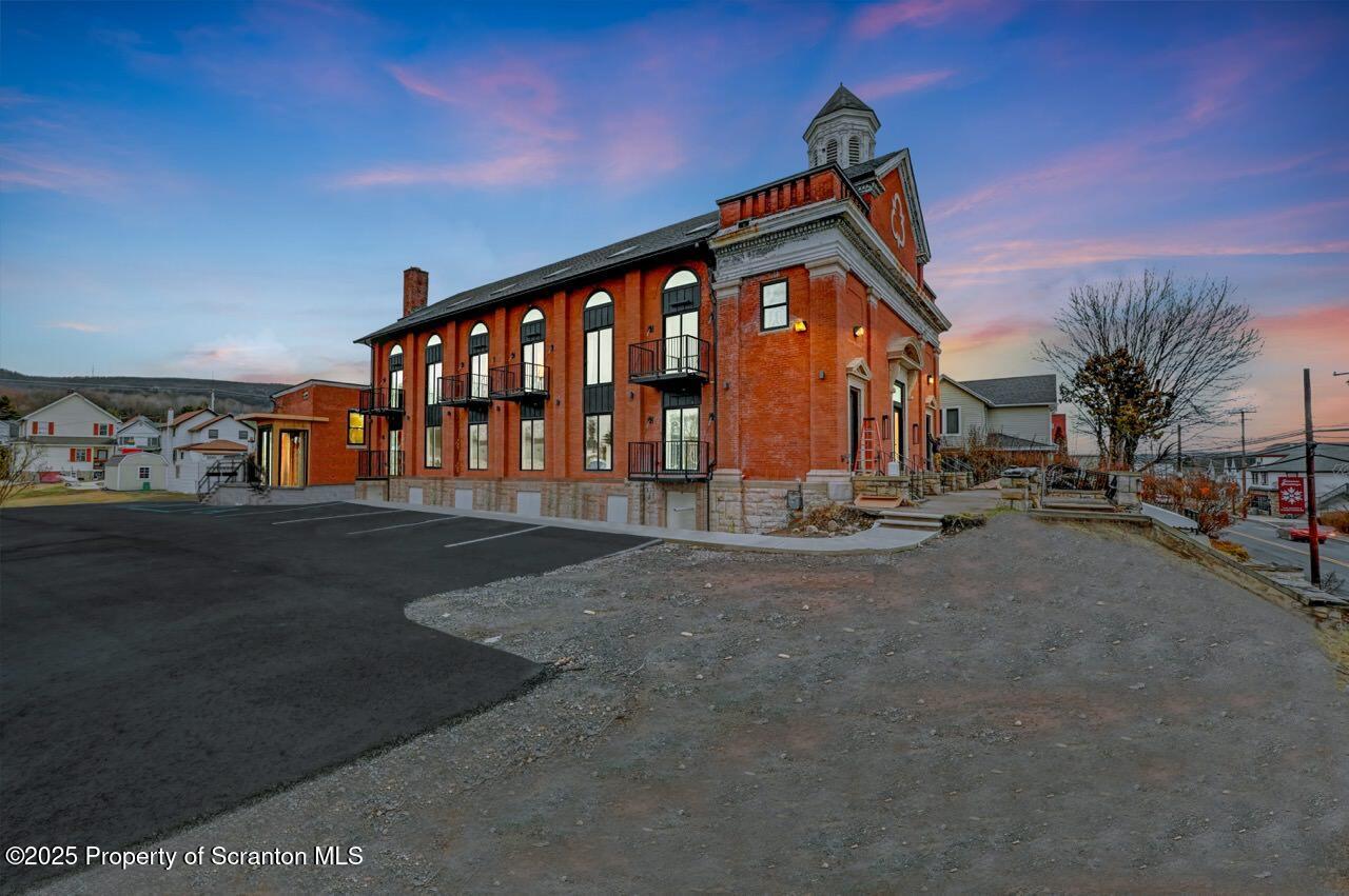 a view of a house with a street