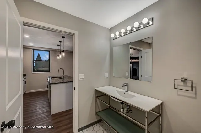 a bathroom with a sink double vanity and a mirror