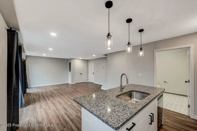 a kitchen with sink and window