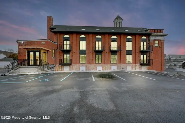 a front view of building with yard