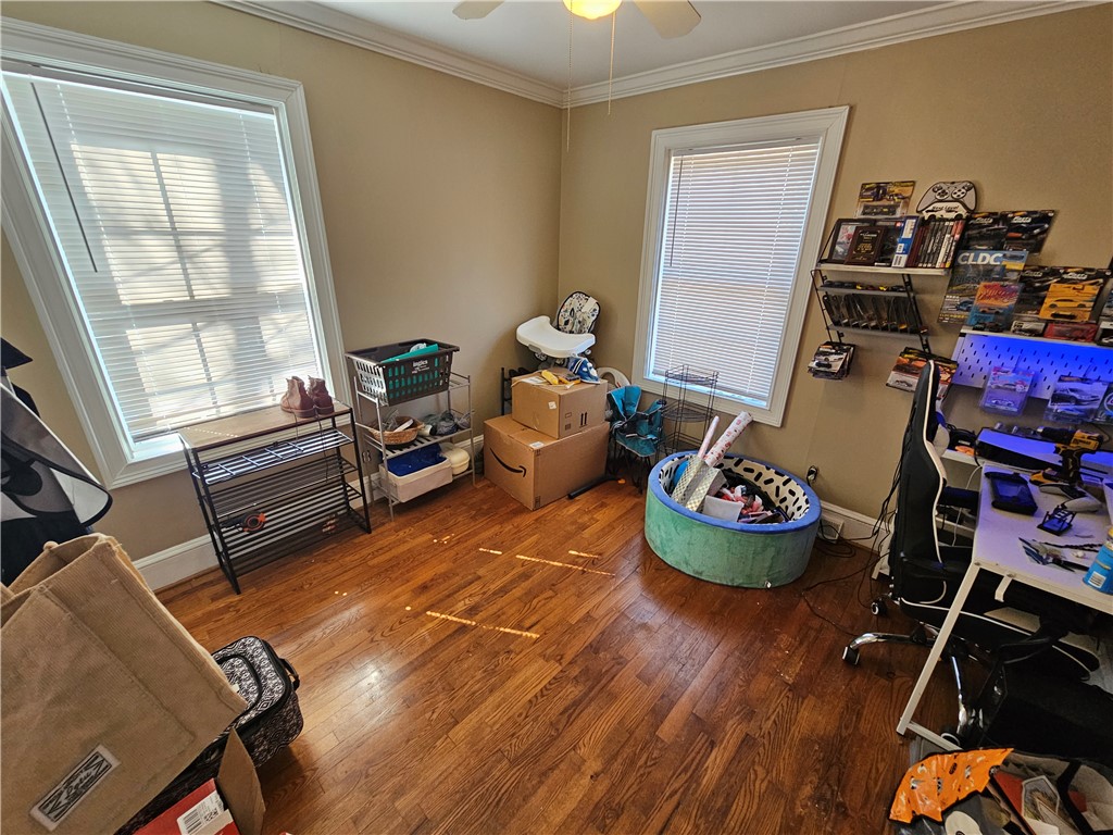 237 Pine Lane Anderson, SC 29621 - Photo 21 of 23 This versatile room features warm hardwood flooring, natural light, and classic crown molding.