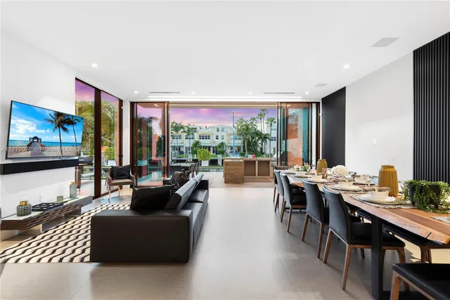 a room with pool table and flat screen tv