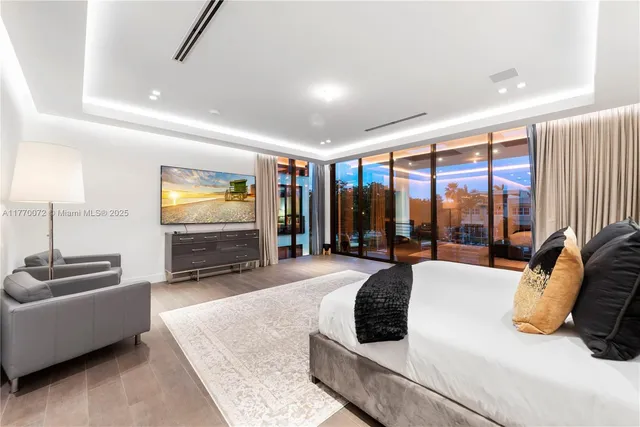 a bathroom with a glass shower door and a shower