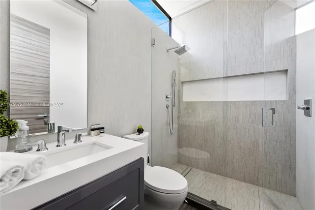 a utility room with sink dryer and washer