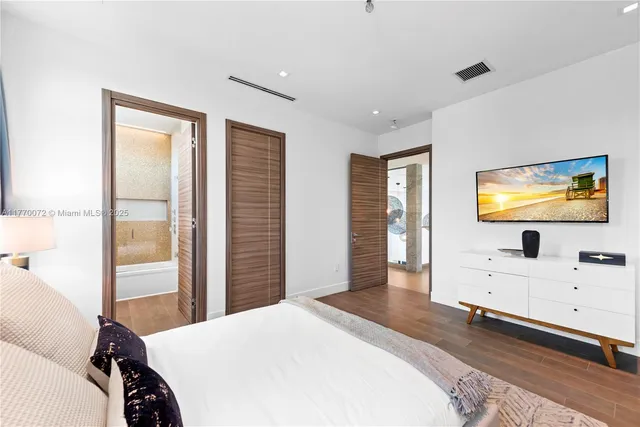 a living room with fireplace furniture and a large window
