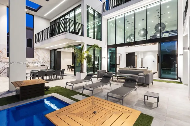 a view of swimming pool with outdoor seating