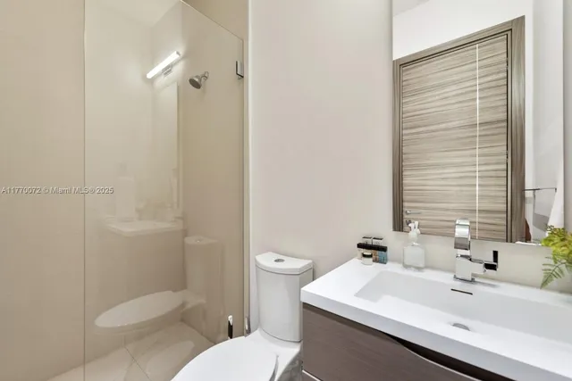 a view of a balcony with chairs and potted plant