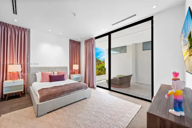 a view of a house with swimming pool and sitting area